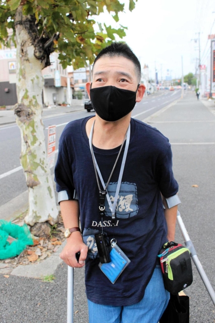 「障害者の声を国政に」と訴える福田剛さん＝明石市