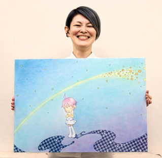 「星に願いを」の原画をもつ色鉛筆アーティストのＴＯＮさん＝明石市内