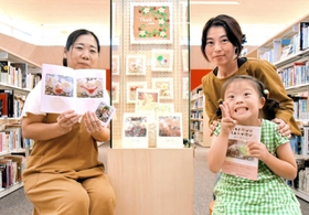 絵本を出版した片岡加奈子さん（右）と次女の來紀さん。挿絵に使う小物やクッキーを作った濱田宏美さん（左）＝津名図書館
