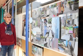 路地のネコを題材にしたデジタル画や油絵を展示する山田宗宏さん＝洲本市本町８