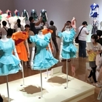 Ｐｅｒｆｕｍｅの歴代のステージ衣装が並び、多くの来館者でにぎわう展示室＝９日午前、神戸市中央区脇浜海岸通１（撮影・長嶺麻子）