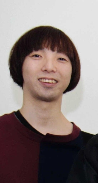 桑原康伸さん