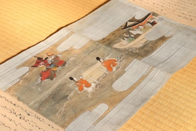 善通寺に伝わる秦武文の絵巻物。姫を救うため、海から現れた武者姿の武文の姿が描かれている＝尼崎市寺町、善通寺
