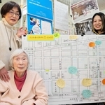 思い出地図の作成で情報提供を呼びかける岩野さん家族＝西宮市西田町