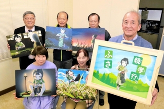 新たに制作した紙芝居「親孝行なふさ」をＰＲする三草ふれあい広場メンバー＝加東市上三草