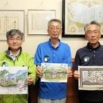 森安小春さんの絵本を手にする「市原村づくり協議会」の池田富美雄さん（中央）、中川利彦さん（右）、伊藤誠さん。服には大根のマークがある＝多可町加美区市原