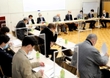 コロナ回復患者の転院を受け入れた際の支援制度について、神戸市職員の説明に耳を傾ける民間病院の院長ら＝１０日午後、神戸市中央区花隈町