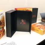 「パティシエ　エス　コヤマ」のパッケージが並ぶ常設展＝神戸市中央区新港町、フェリシモ　チョコレートミュージアム