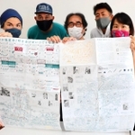 「地図版・塩屋市」をＰＲする森本アリさん（左から２人目）ら「シオヤプロジェクト」や塩屋商店会のメンバー＝神戸市垂水区塩屋町３