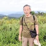 六甲山の研究を続ける六甲歴史散歩会代表の前田康男さん＝六甲山最高峰