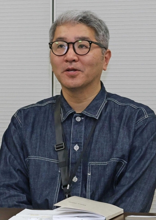 震災当時、２０歳だった住田英隆さん。「１．１７の灯り文字」の準備を通して、自身の経験を若手に話したという＝関西電力送配電神戸本部