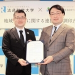 連携協定書に調印した流通科学大の清水信年学長（右）とネスタリゾート神戸の田中淳社長＝三木市細川町垂穂