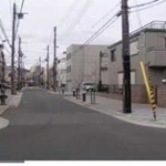 震災１１年後までには道路が舗装され、住宅が立ち並んだ＝神戸市長田区海運町４（山下さん提供）
