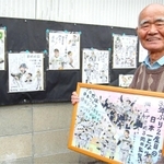 自宅前のミニギャラリーで、阪神日本一の瞬間を描いた作品を手にする角本勝さん＝相生市那波野１
