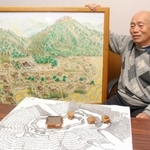 春日山城の往時の姿を復元図や模型で表現した木内内則さん＝福崎町八千種