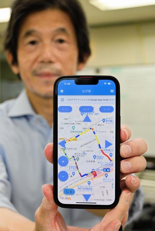 車椅子利用者のこぐ力に応じ、進みやすい坂道を表示する地図アプリ「なび坂」＝神戸市内