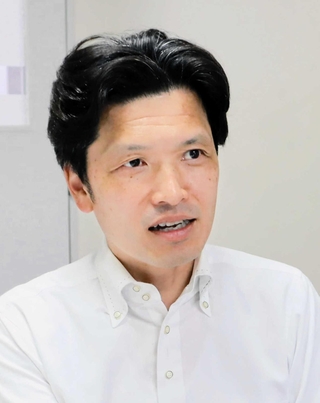 「保育所なども含めた議論が必要」と指摘する神戸女子大の山内紀幸教授＝神戸市須磨区東須磨