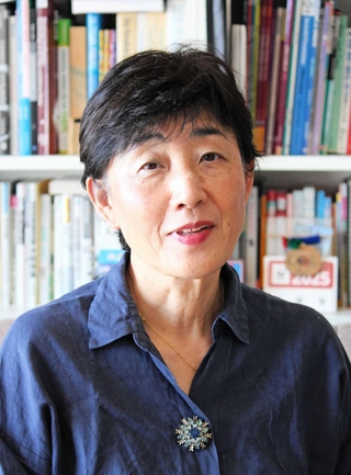 「同じ放射線被害に苦しむ子どもを救いたい」と願うカオルさん＝神戸市東灘区