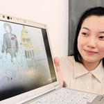 高校生平和大使として活動した原野蓉子さん。紙芝居には武田キヨさんの絵も入れた＝西宮市内