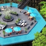 山の緑に囲まれた八角形の「エメラルド・ラウンジ」。ソファやテーブルが並び、くつろぎながら港町の絶景を楽しむことができる＝神戸市中央区（ドローンで撮影）