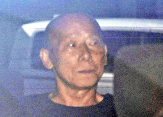 送検される亀谷直人容疑者＝２日午前９時２６分、神戸市中央区橘通１
