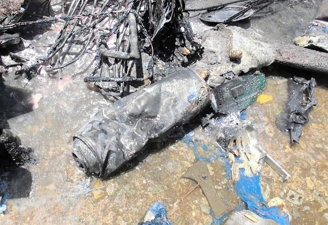 収集車内で燃えたごみの中に缶があった（明石市提供）