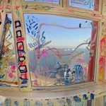 窓や窓枠、壁にカラフルな絵が描かれた神戸ポートタワーの展望２階フロア＝神戸市中央区波止場町（パノラマ撮影）