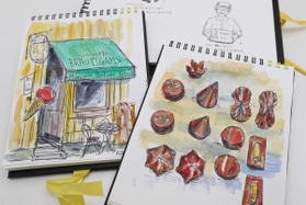 木野内さんが旅先で、チョコや職人、店などを描いたスケッチ帳（撮影・辰巳直之）