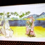 「絵本語り」より。山ノ上のおじ（左）、小太郎を抱いた犀龍