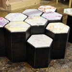 高さが異なる六角形の椅子で、座面には絹織物の帯地を再利用した。椅子の中は収納が可能＝豊岡市小島