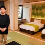 客室をワーケーションに対応した部屋に改装した、近藤正幸さん＝「国領温泉　助七」