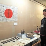 出征する兵士への寄せ書きなどが展示されている企画展会場＝丹波市春日町黒井