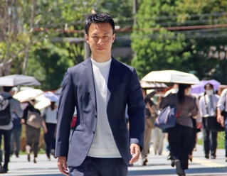 山中哲男さんはコンサルティング会社社長として、飲食、医療、金融など多彩な分野の事業に関わっている＝大阪市北区