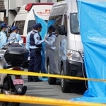 　成人女性２人の遺体が見つかった広島市南区の現場付近＝２９日午後１時３３分