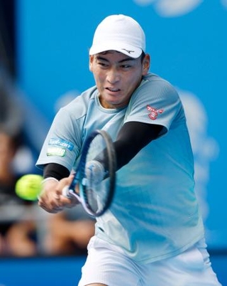 　男子シングルス決勝でプレーする田口涼太郎＝有明コロシアム