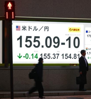 　外国為替市場の対米ドルの円相場を表示するボード＝１８日午後、東京都中央区