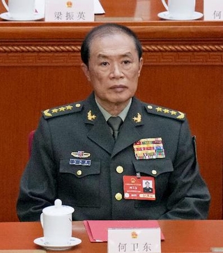 　２０２５年３月、中国全人代の閉幕式に出席した何衛東・中央軍事委員会副主席＝北京の人民大会堂（共同）