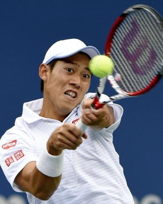２０１４年９月、全米オープン男子シングルス決勝でプレーする錦織圭選手＝ニューヨーク（共同）
