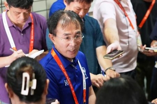 　公式記者会見後に取材に応じる大会組織委の大参孝彰事務局次長＝２２日午後、名古屋市