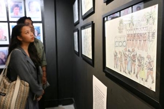 　旧日本軍による性暴力の実態を伝える展覧会で展示されるイラスト＝１日、フィリピン・マニラ（共同）