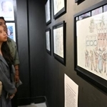 　旧日本軍による性暴力の実態を伝える展覧会で展示されるイラスト＝１日、フィリピン・マニラ（共同）