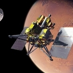 　探査機ＭＭＸのイメージ。右の天体が火星、左が衛星のフォボス（ＪＡＸＡ提供）
