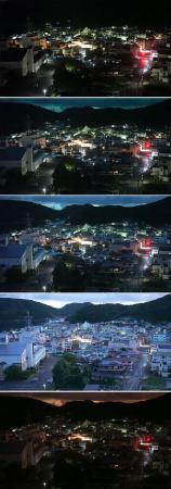 　強い光に照らされた高知県土佐清水市＝１９日午後１１時８分（無人定点カメラで撮影）