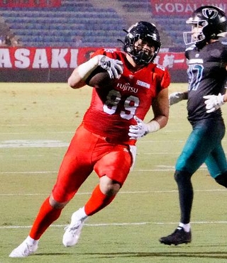 　富士通-富士フイルム海老名　第２クオーター、タッチダウンを決める富士通・福井＝秩父宮