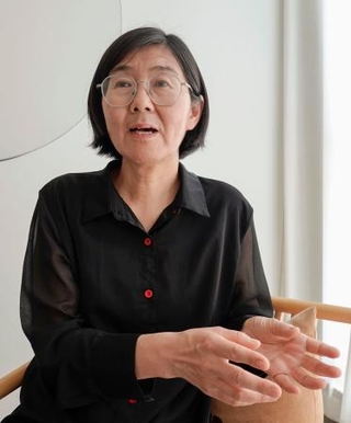 　取材に応じる、人権派弁護士として活躍していた王宇氏（共同）