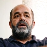 　取材に応じるムンジル・アミラさん＝９日、ヨルダン川西岸ベツレヘム近郊（共同）